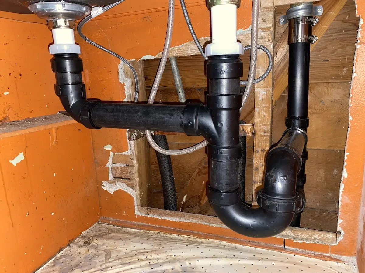 Professional Garbage Disposal Repair equipment and tools on the job in Putney